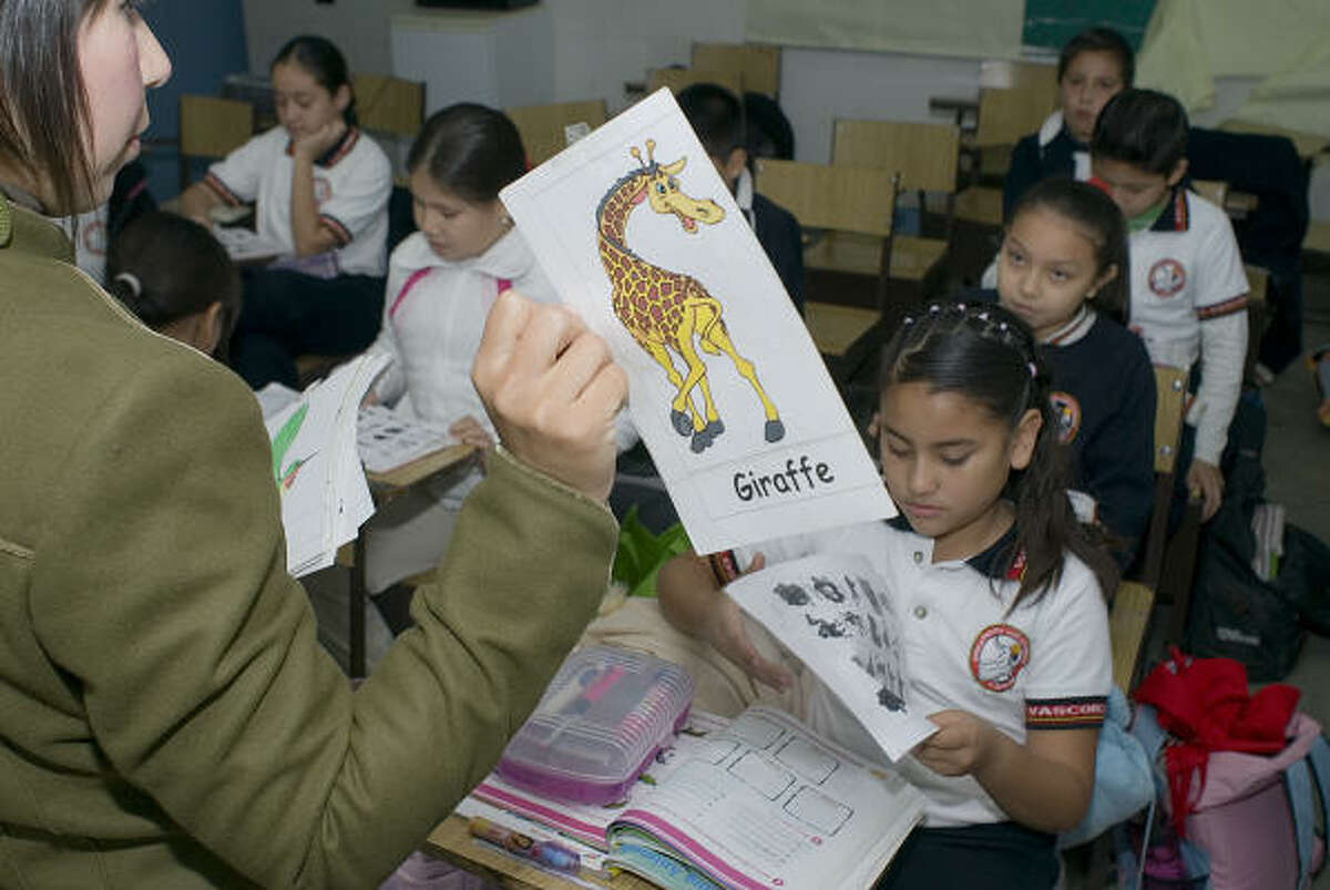 Sixth-grade students at the José Vasconcelos Elementary School in Ciudad Victoria, Tamaulipas, play a game using animal figures to help them develop English skills. The goal is to make Tamaulipas the first bilingual state in Mexico.