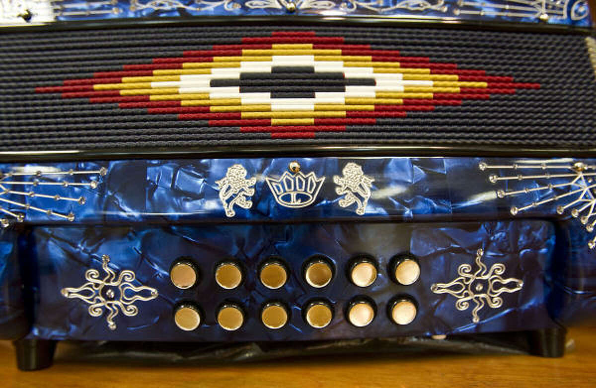 A detail photograph of the 50th anniversary crown enblem on a Gabbanelli accordion.
