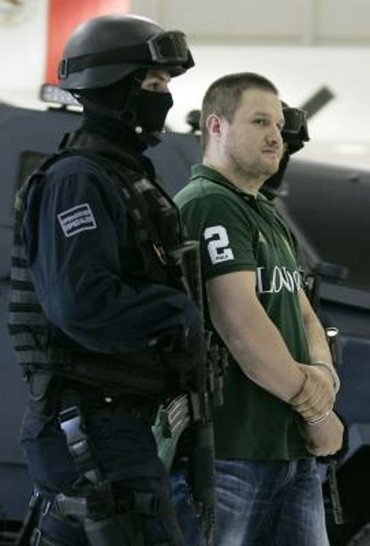 Edgar "La Barbie" Valdez Villarreal is shown to the media during a news conference at the federal police center in Mexico City in 2010.