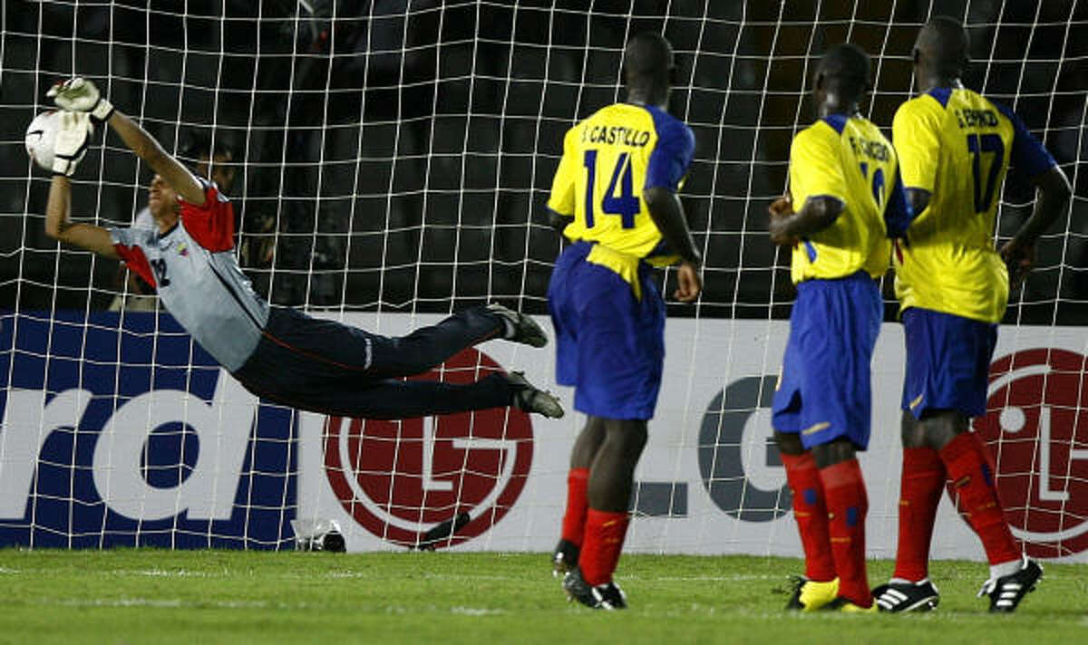 Carlos Villanueva (not pictured) slips a free kick past Ecuador goalkeeper Cristian Mora to lift Chile to a 3-2 victory.