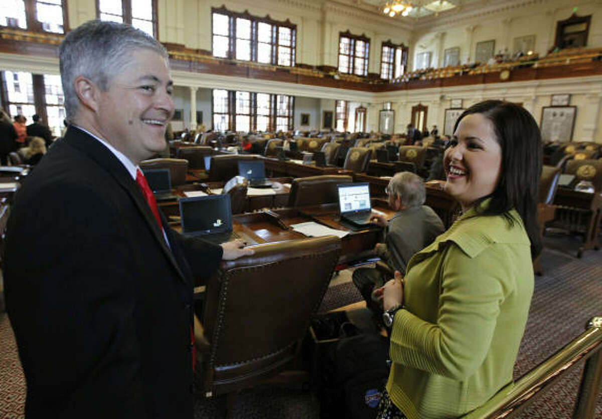 Rep. Ana Hernandez Luna, D-Houston, talks last week with Rep. John Frullo, R-Lubbock, on the floor of the House of Representatives at the Capitol in Austin.