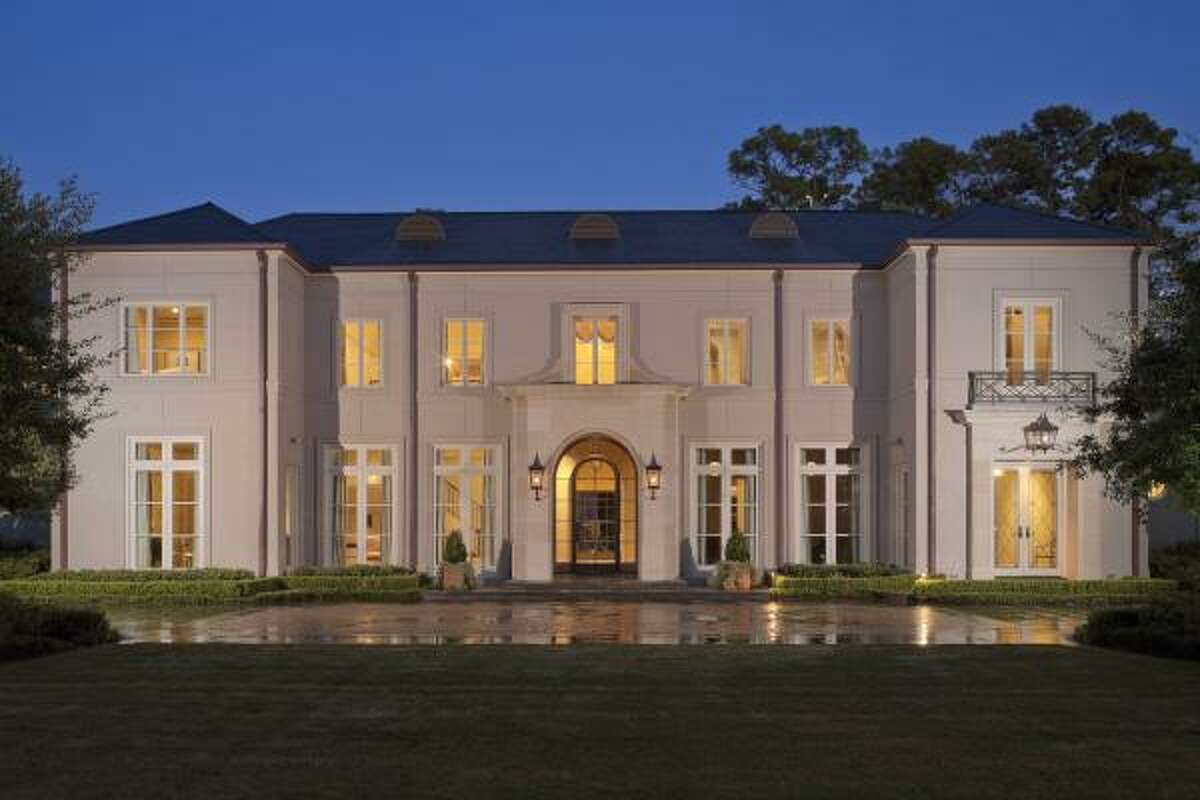 A large driveway leads to the front of the home. Rudy Colby of Colby Design designed this neoclassical-style home in Piney Point. It was built by Andy Abercrombie of Abercrombie Builders in 2006.