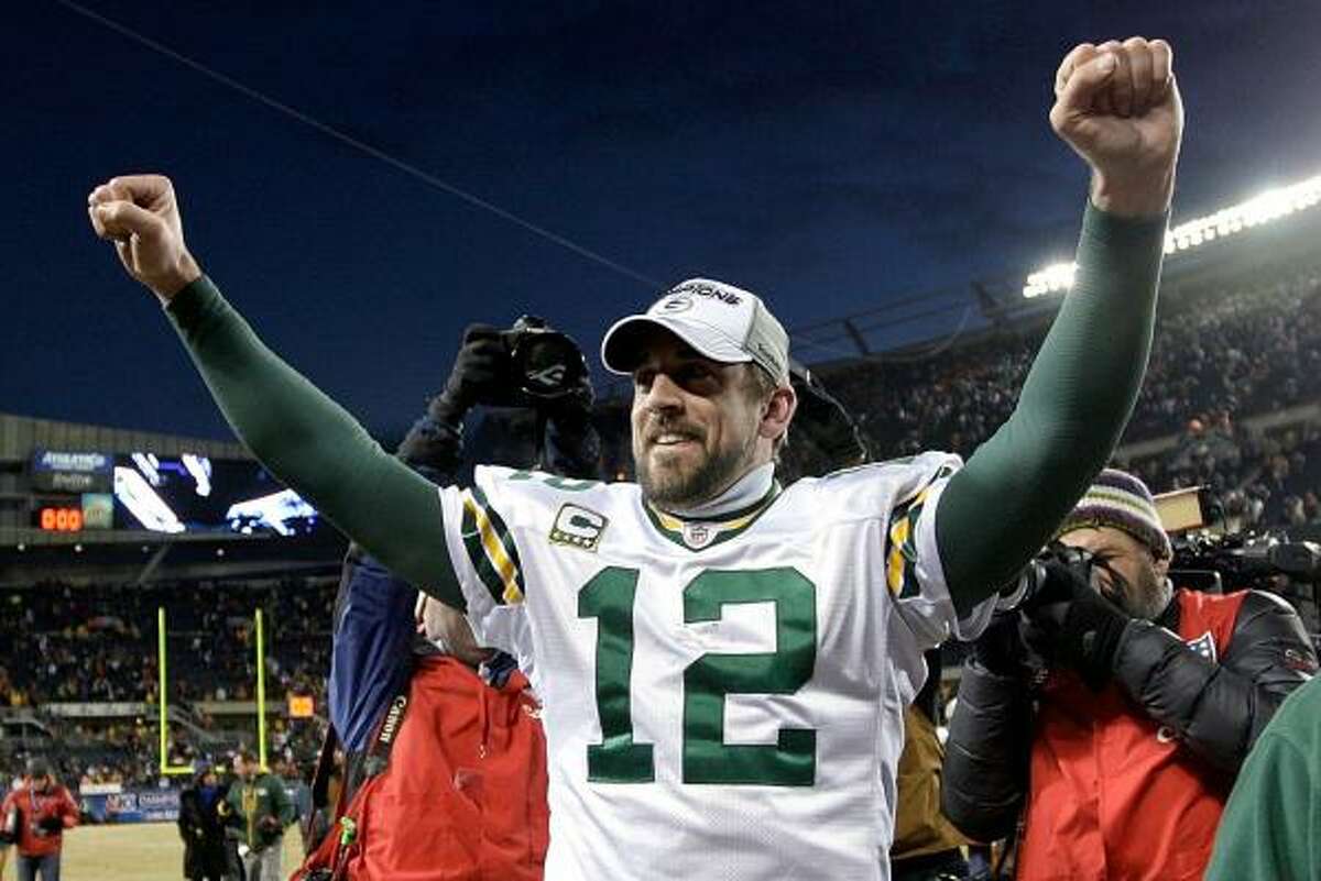 Packers quarterback Aaron Rodgers celebrates the 21-14 victory over rival Chicago.