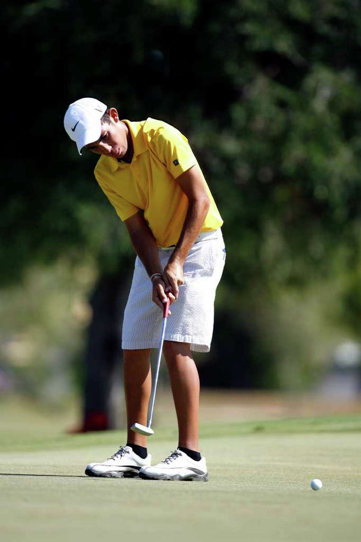 Alex Bissaro putts during the Greater San Antonio Junior Championship at Brackenridge Golf Course on Thursday, July 28, 2011. Bissaro gained the title after losing on the final hole last year.