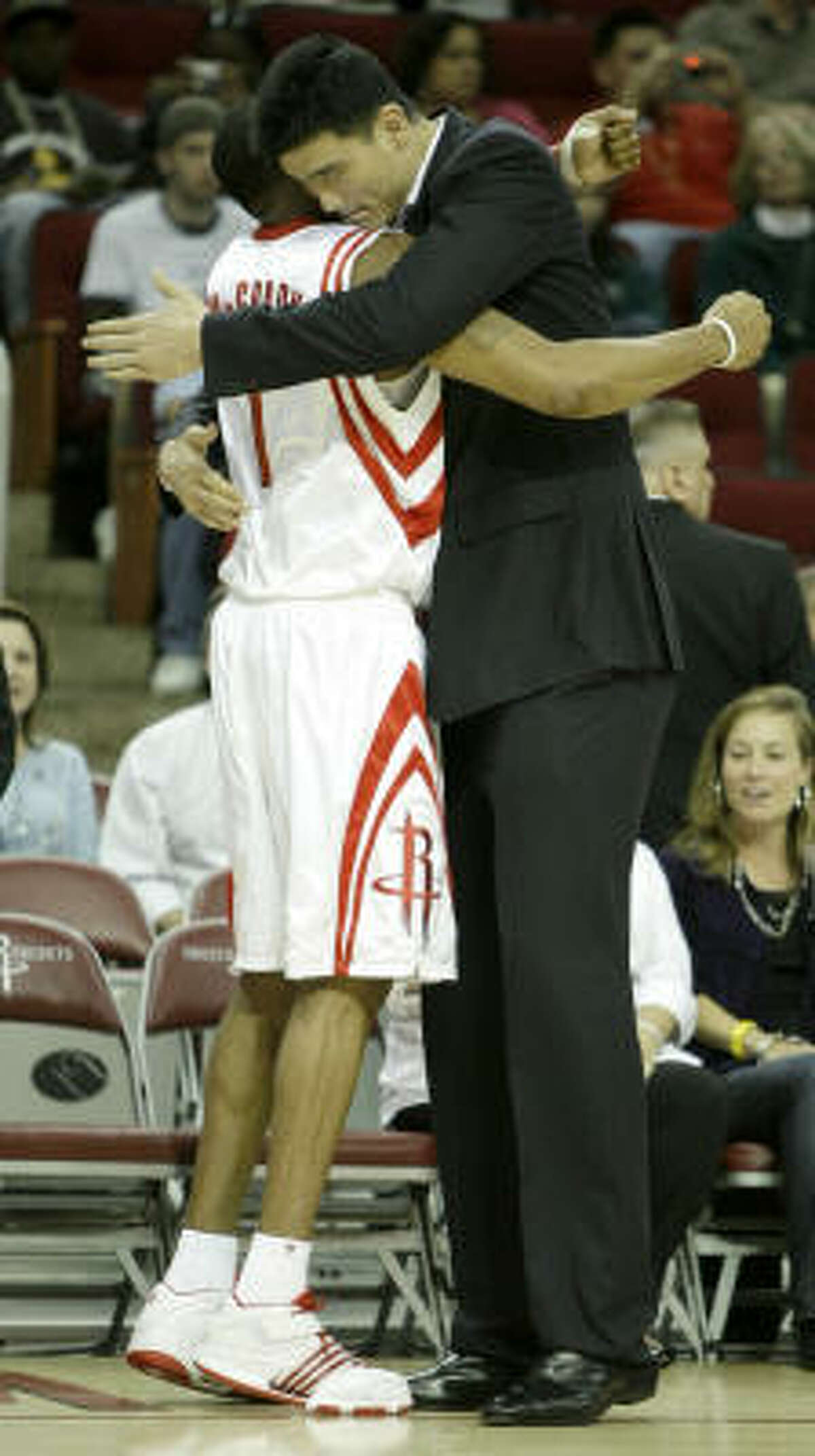 Yao Ming and Tracy McGrady hug after a game last year. Yao said Thursday that things are fine between the teammates.