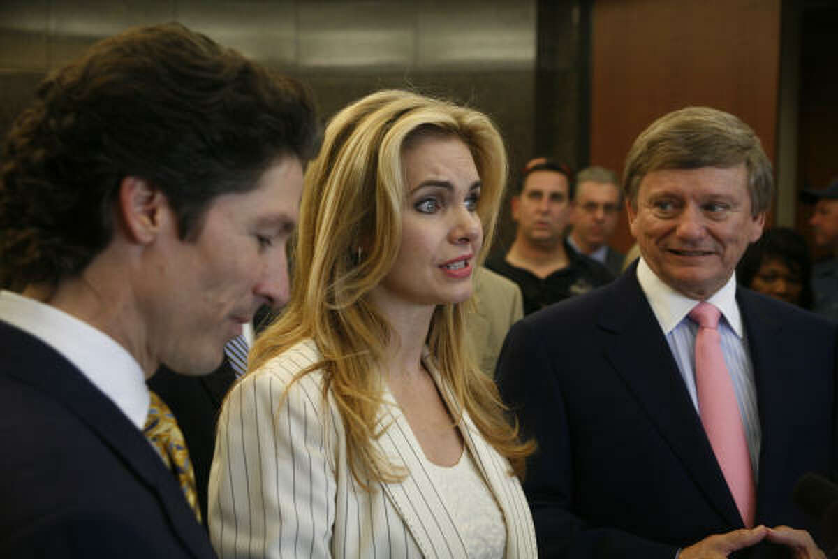 Lakewood Church co-pastor Victoria Osteen, her husband, Joel Osteen, left, and attorney, Rusty Hardin, share their reactions after a jury found that she did not assault a Continental Airlines flight attendant.