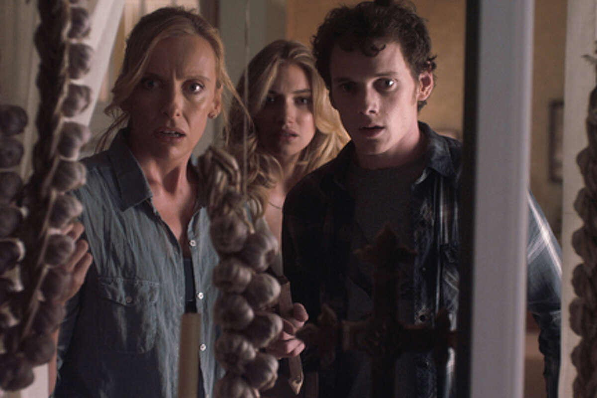 (L-R) Toni Collette as Jane Brewster, Imogen Poots as Amy Peterson and Anton Yelchin as Charlie Brewster in "Fright Night."