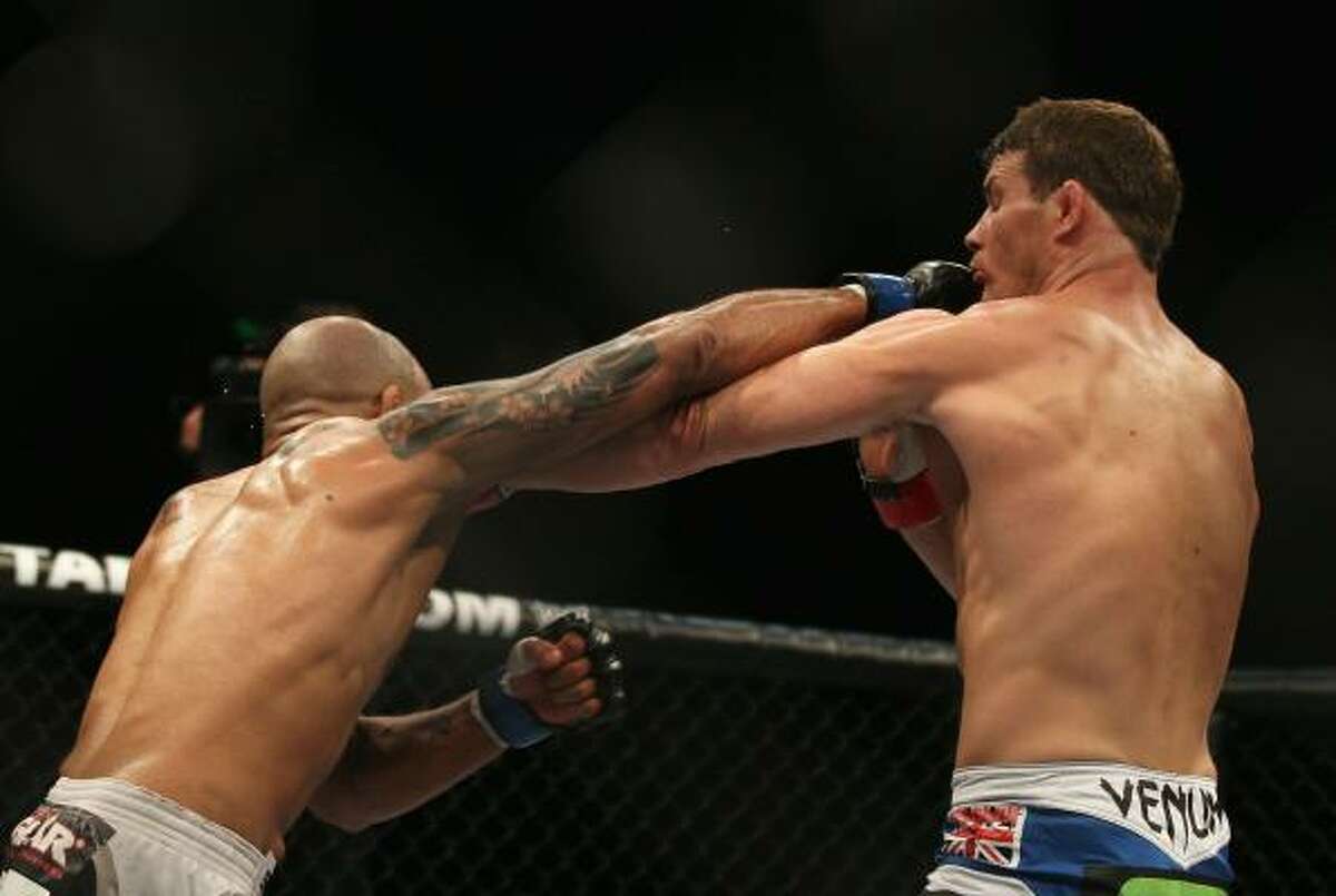 Jorge Rivera, left, and Michael Bisping trade blows.