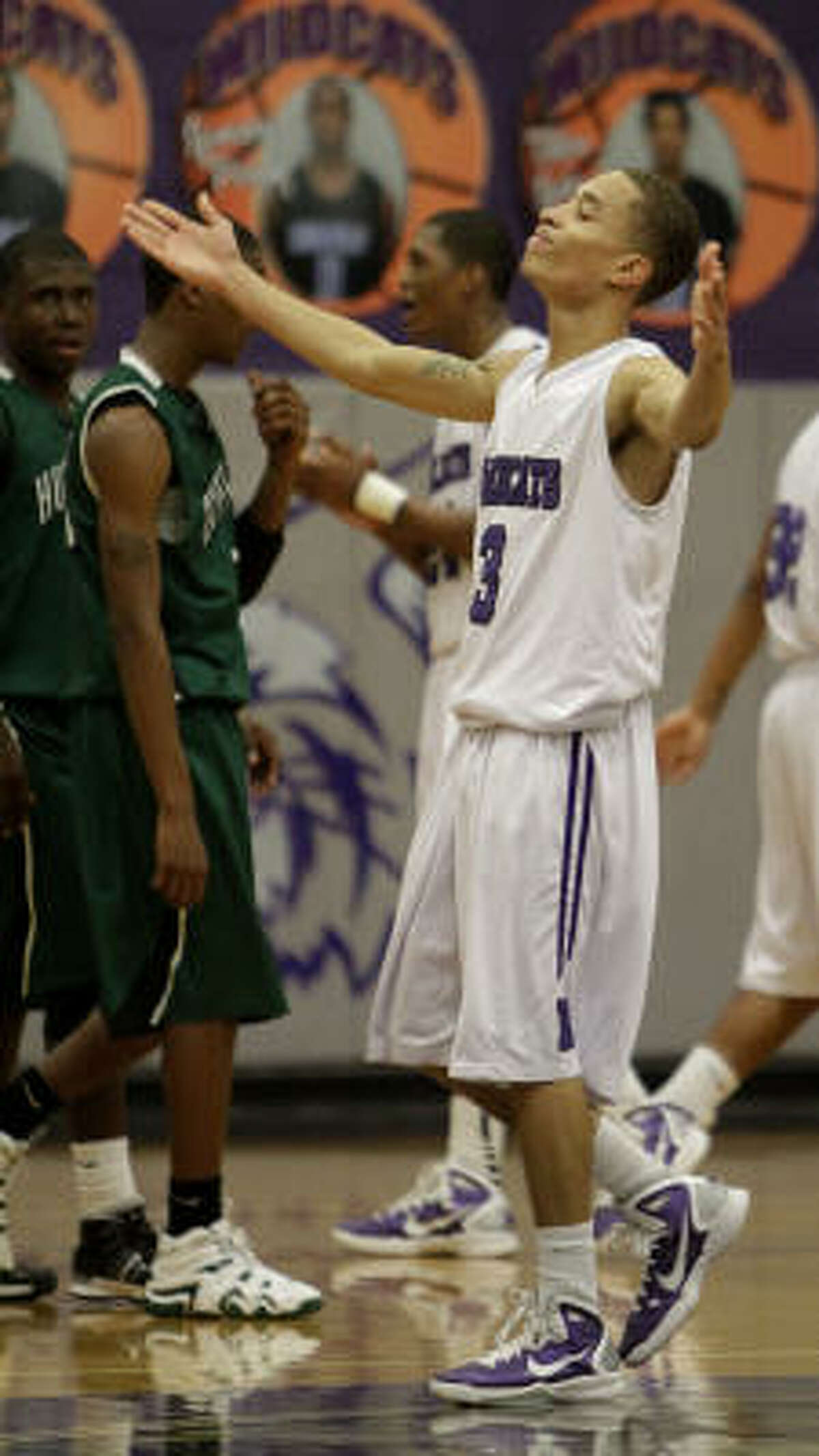 Humble's Chevas Wilson celebrates his team's victory in the game's final seconds.