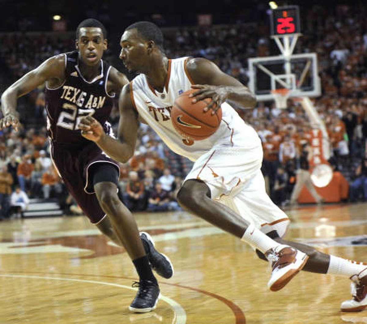Jan. 19: Texas 81, Texas A&M 60 Texas forward Jordan Hamilton, right, drives around Texas A&M forward Khris Middleton during the second half of Wednesday night's game in Austin. Hamilton scored a game-high 27 points on 10-of-14 shooting.