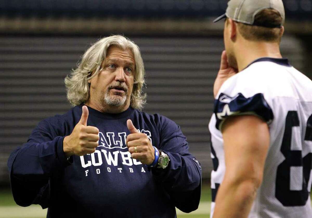 Defensive coordinator Rob Ryan (left) chats with tight end Jason Witten after the morning session of the Dallas Cowboys training camp at the Alamodome on Friday, July 29, 2011. Kin Man Hui/kmhui@express-news.net