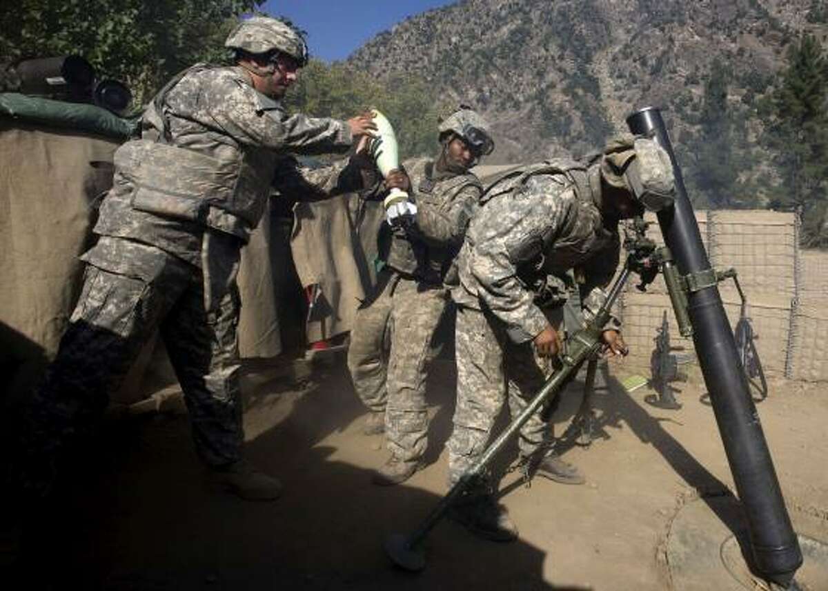 U.S. soldiers respond with mortar fire from their outpost near Kamu after coming under attack Thursday. The outpost took no direct hits, and there were no U.S. casualties.
