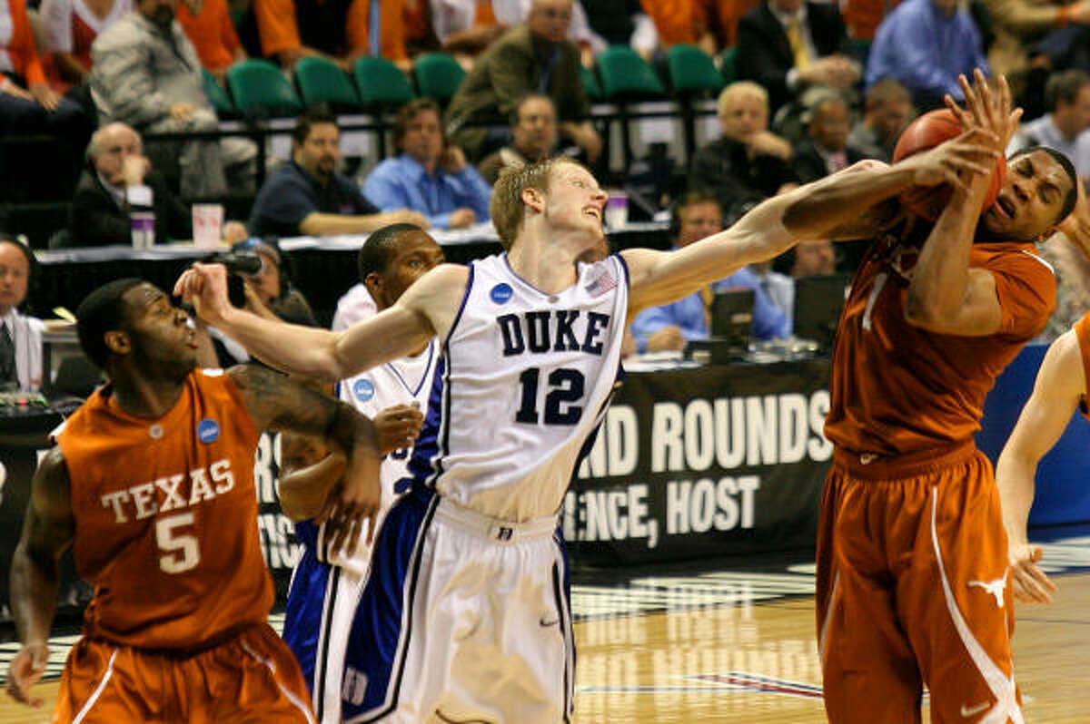 Gary Johnson, right, pulls a rebound away from Duke's Kyle Singler (12) during Saturday's 74-69 loss to the Blue Devils in the East Regional.