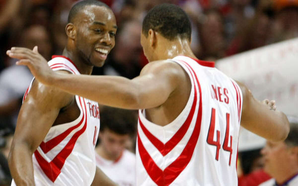Carl Landry, left, will be on board when Chuck Hayes and the rest of the Rockets start camp.
