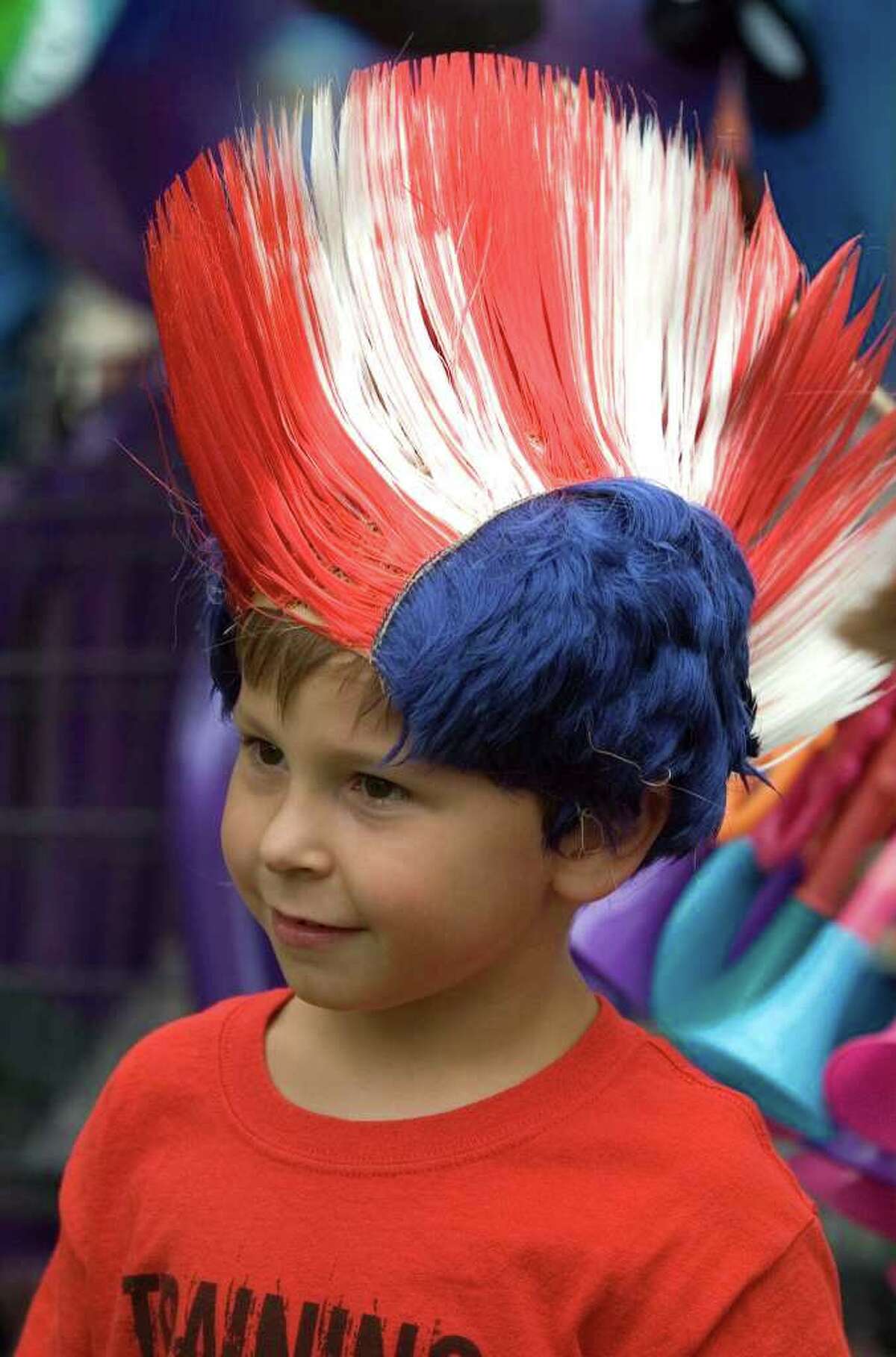 Blake Bennett, 5, of New Milford, sports the red, white and blue Mohawk wig he got at the Fun Haven stall during the 44th Annual New Milford Village Fair Days on Friday, July 29, 2011.