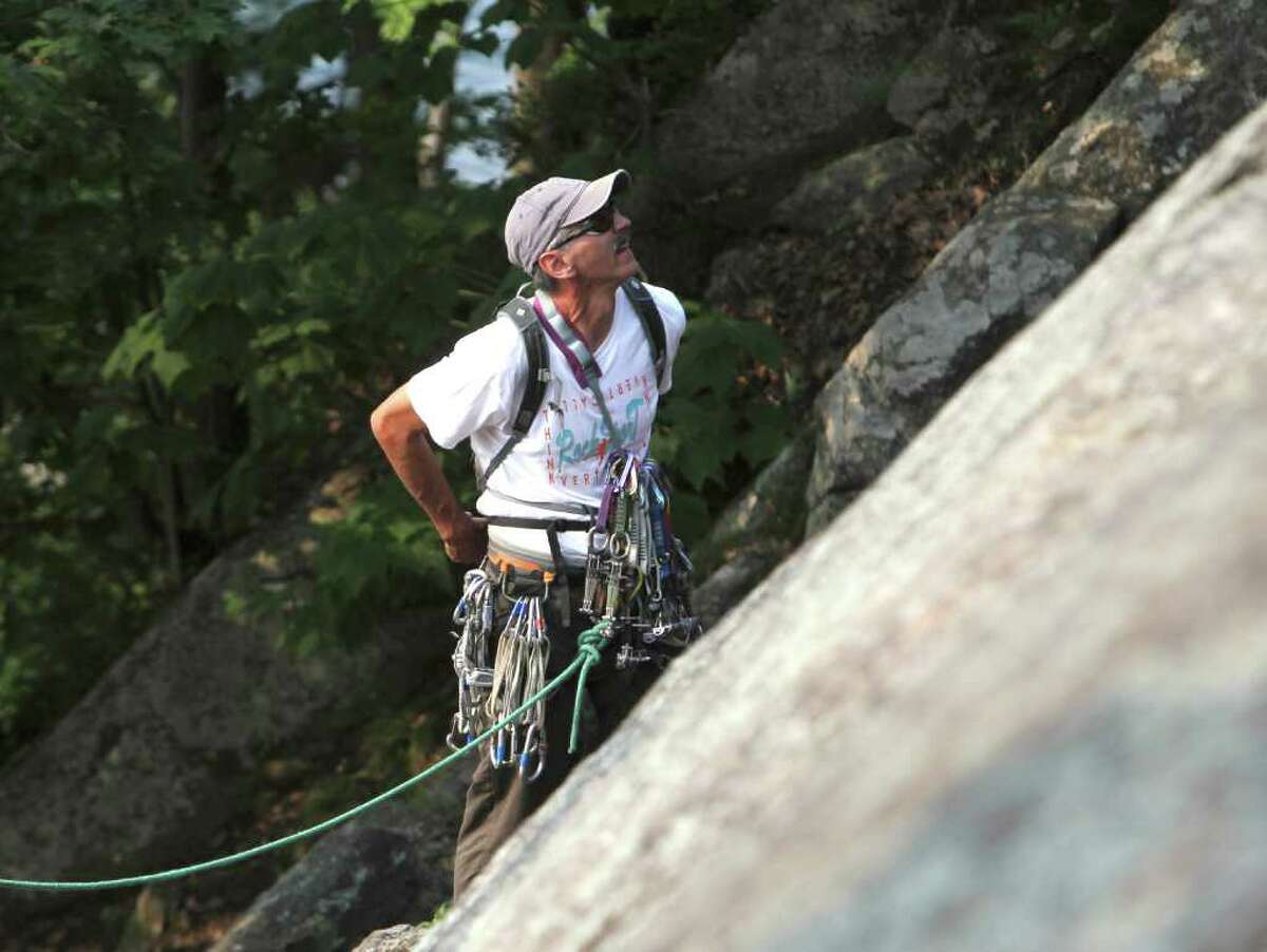 Adirondack waterside cliffs draw climbers in boats