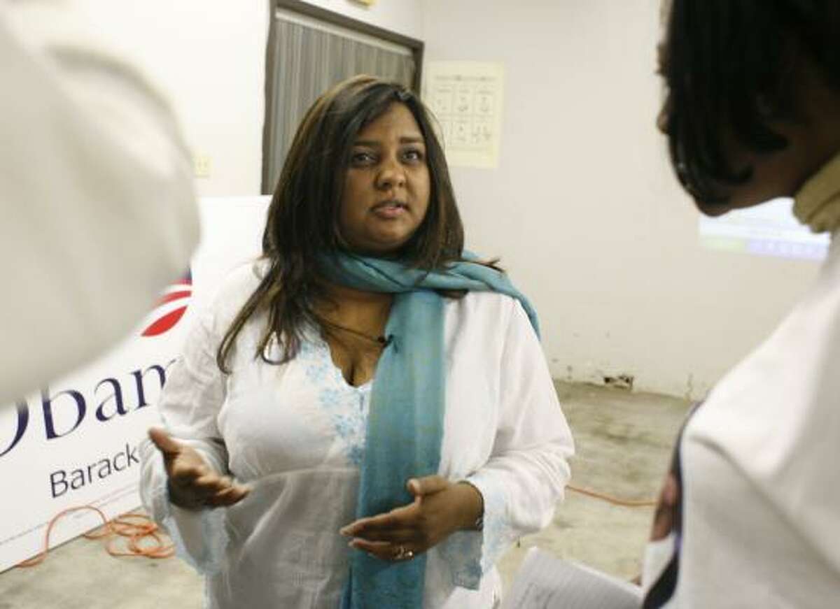 Sumita Prasad explains Texas' electoral hybrid of primary polls and caucuses to Barack Obama supporters at a seminar Thursday. "You don't need to know math or formulas," she says.