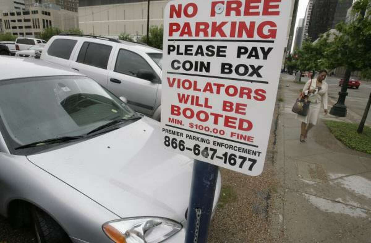 The city of Houston is working on an ordinance that may make more parking lots post signs regarding their payment and car-booting procedures.