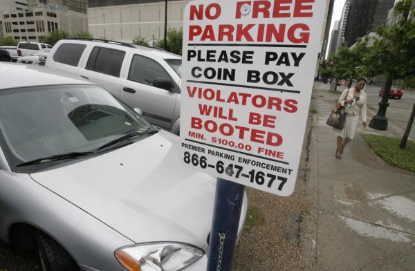 Drivers Downtown Houston lots wrongly putting boot on cars