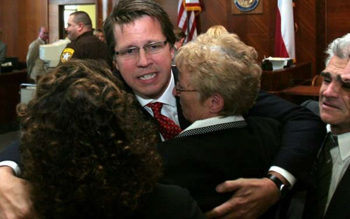 Plaintiff's attorney Mark Lanier hugs his client, Carol Ernst, after the ruling in 2005.