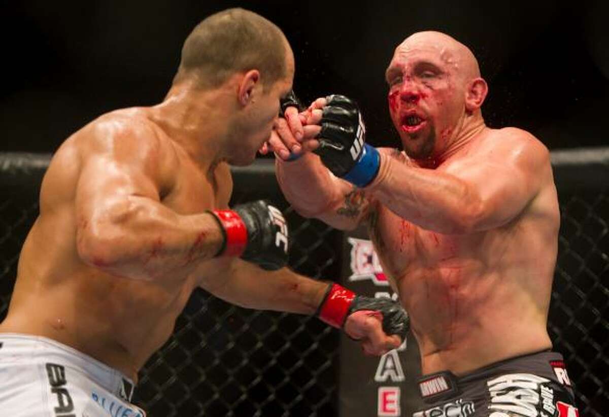 Junior Dos Santos, left, matched wits and fists against Shane Carwin during their main event heavyweight bout at UFC 131 on Saturday night in Vancouver, British Columbia. Dos Santos won by decision.