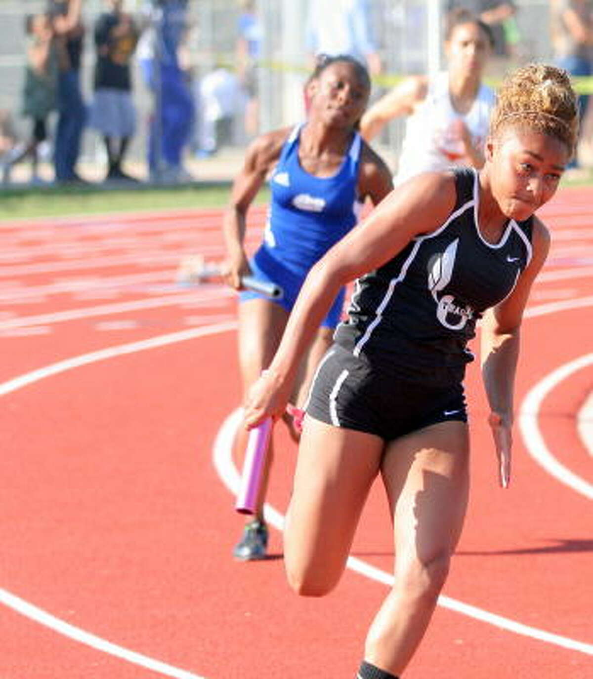 Pearland's Ashton Thomas leads off in the 400-meter relay.