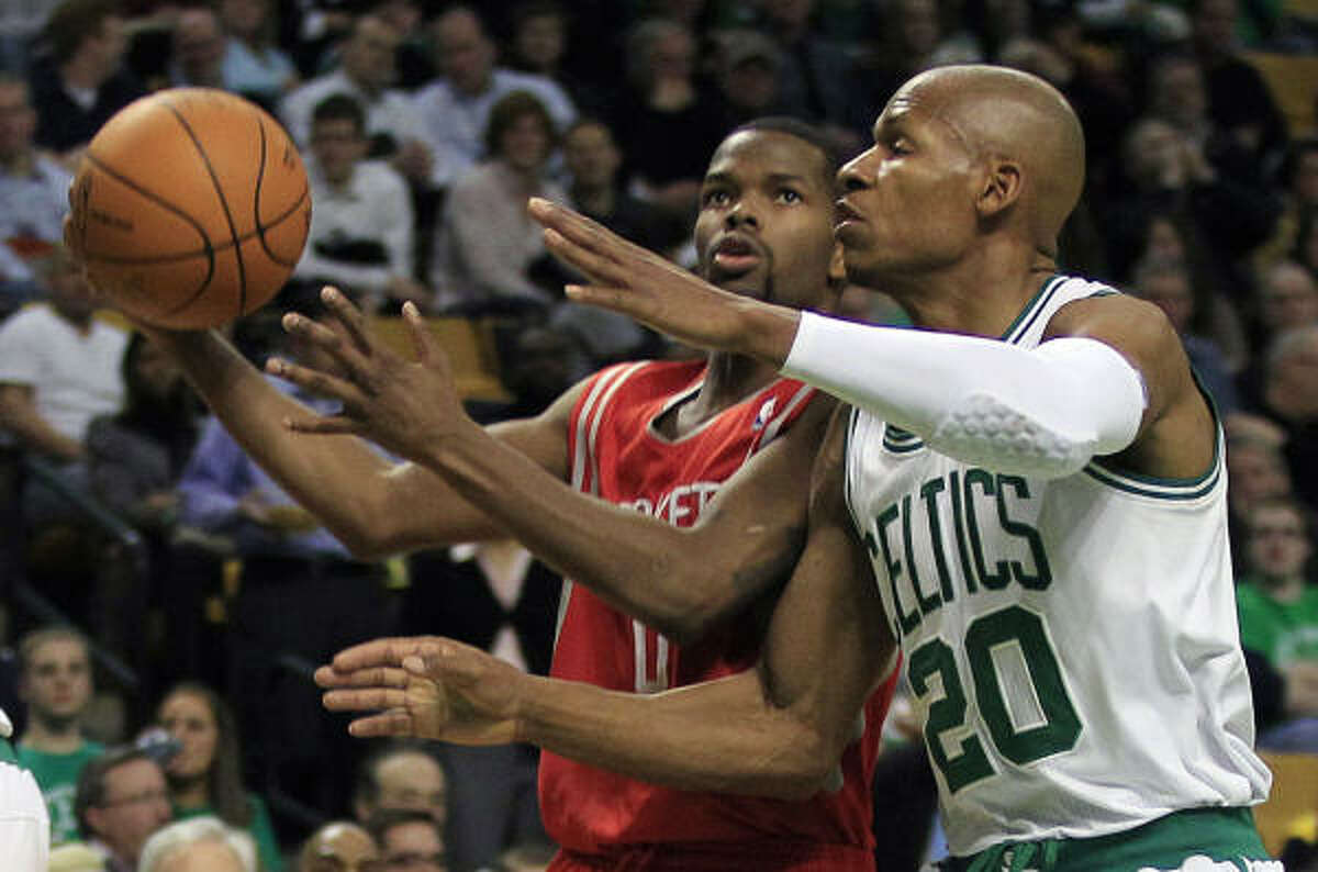 Celtics guard Ray Allen, right, tries to stop Rockets guard Aaron Brooks, left, on a drive to the basket.