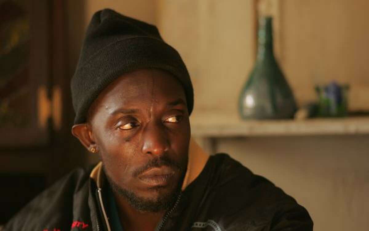 Stickup artist Omar Little (played by Michael K. Williams) was dispatched in shocking fashion Sunday when he took a bullet to the back of the head while buying a pack of cigarettes. His killer? A 12-year-old boy from a rival gang.