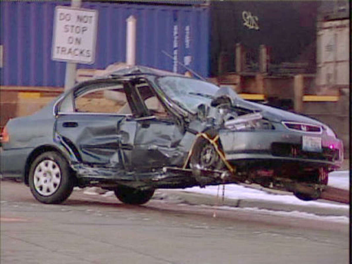 The car driven by Rose Tani, 90, is seen after being struck by a freight train earlier in the day in Lombard, Ill.