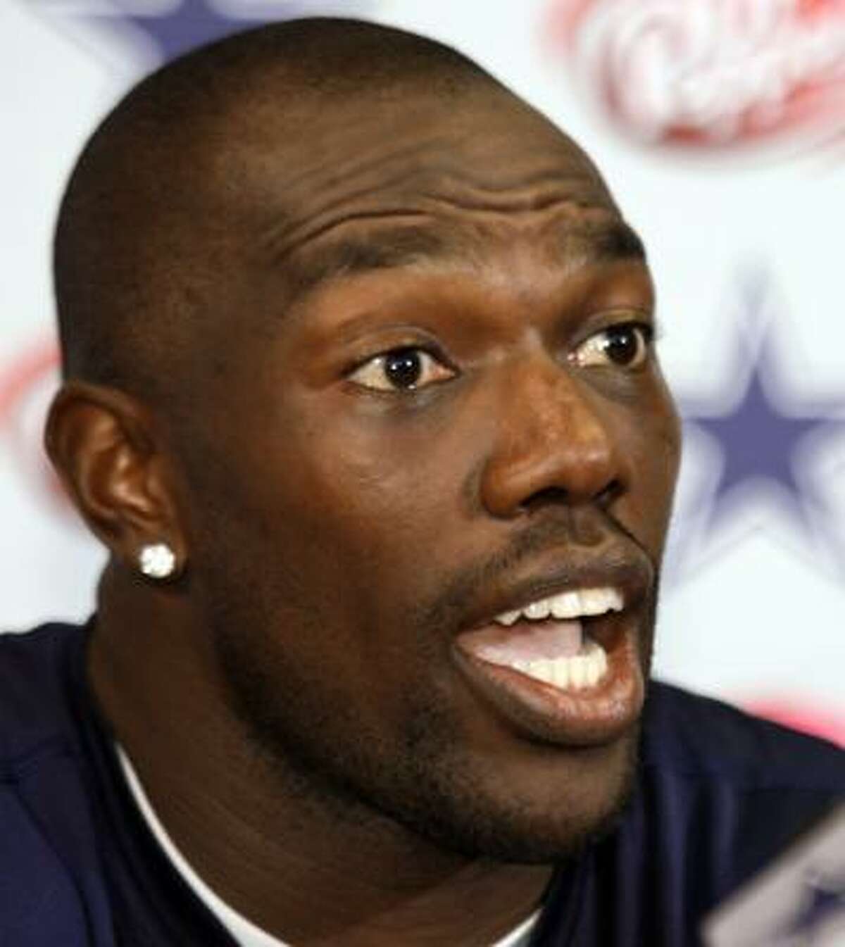 Dallas Cowboys football star Terrell Owens answers questions during a news conference at the teams' headquarters in Valley Ranch.