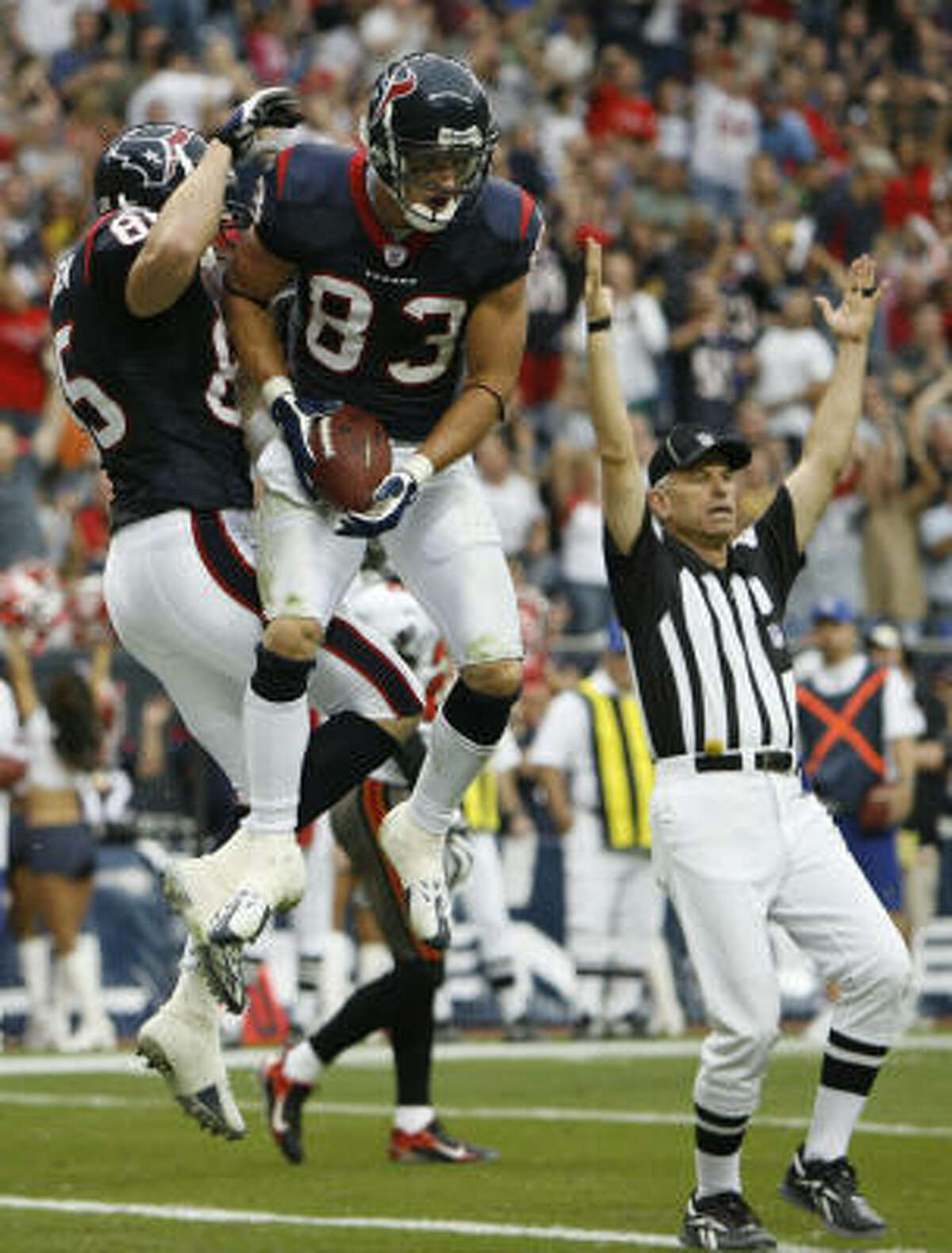 Texans receiver Kevin Walter (83) celebrates his second-quarter touchdown with tight end Joel Dreessen.