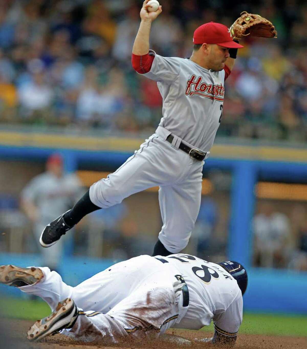 Milwaukee Brewers' Prince Fielder is forced out at second by Houston Astros' Jose Altuve in the sixth inning of a baseball game Sunday, July 31, 2011, in Milwaukee. Yuniesky Betancourt was safe at first base. (AP Photo/Jeffrey Phelps)