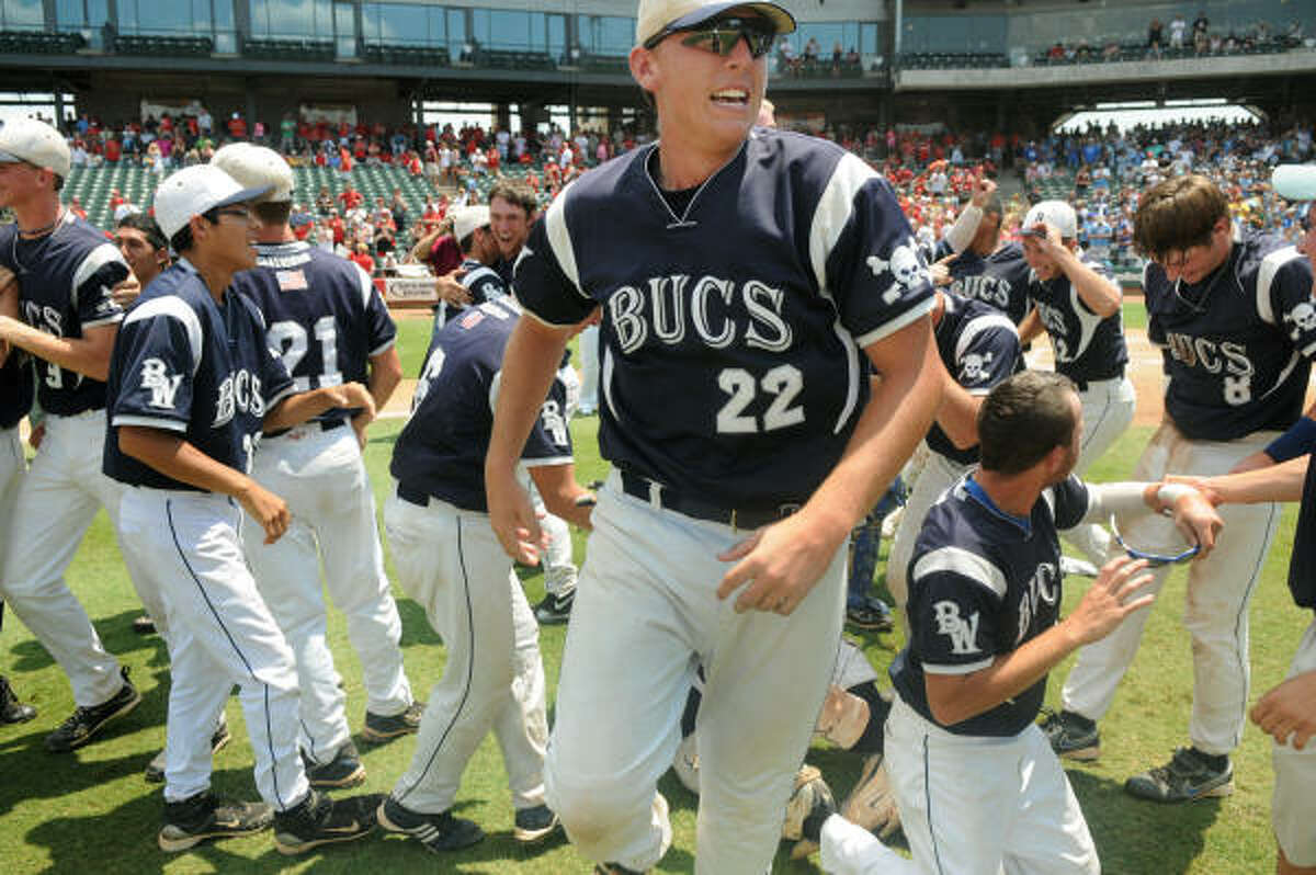 Brazoswood senior first baseman WIliam Easter (22) and his teammates celebrate their state championship.