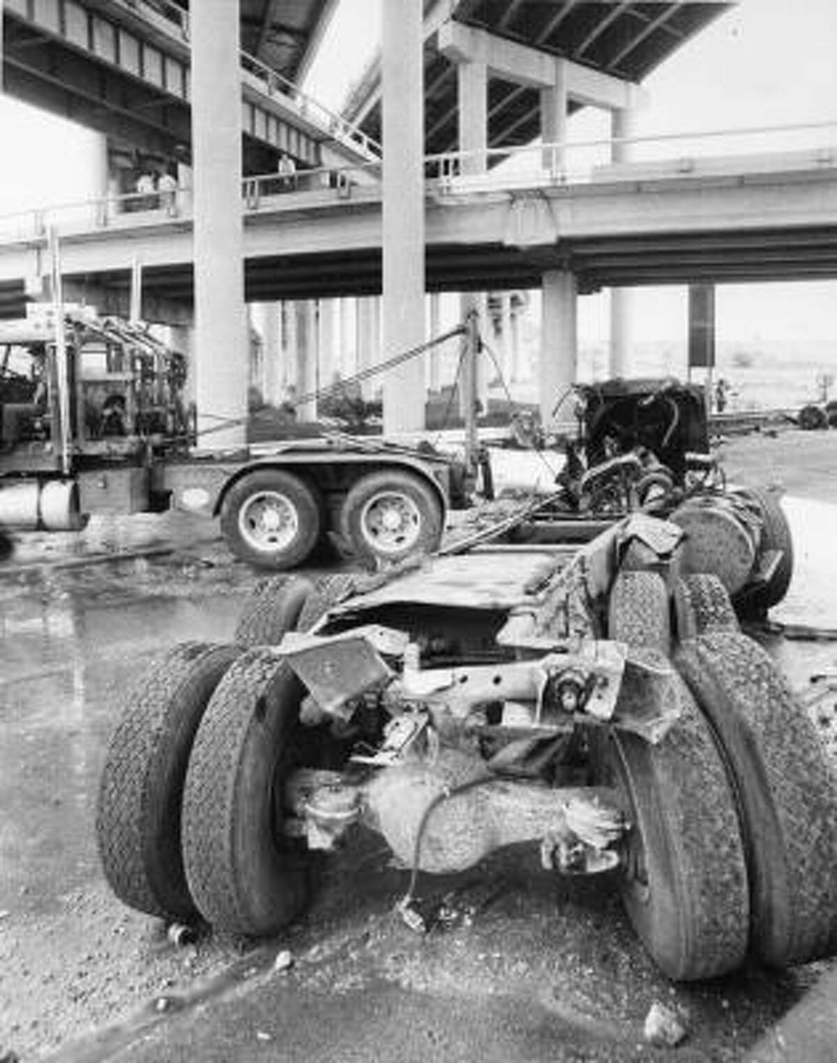 This photo shows the ammonia truck's chassis and vehicle parts being hauled away after the fatal accident and chemical spill of May, 11, 1976.