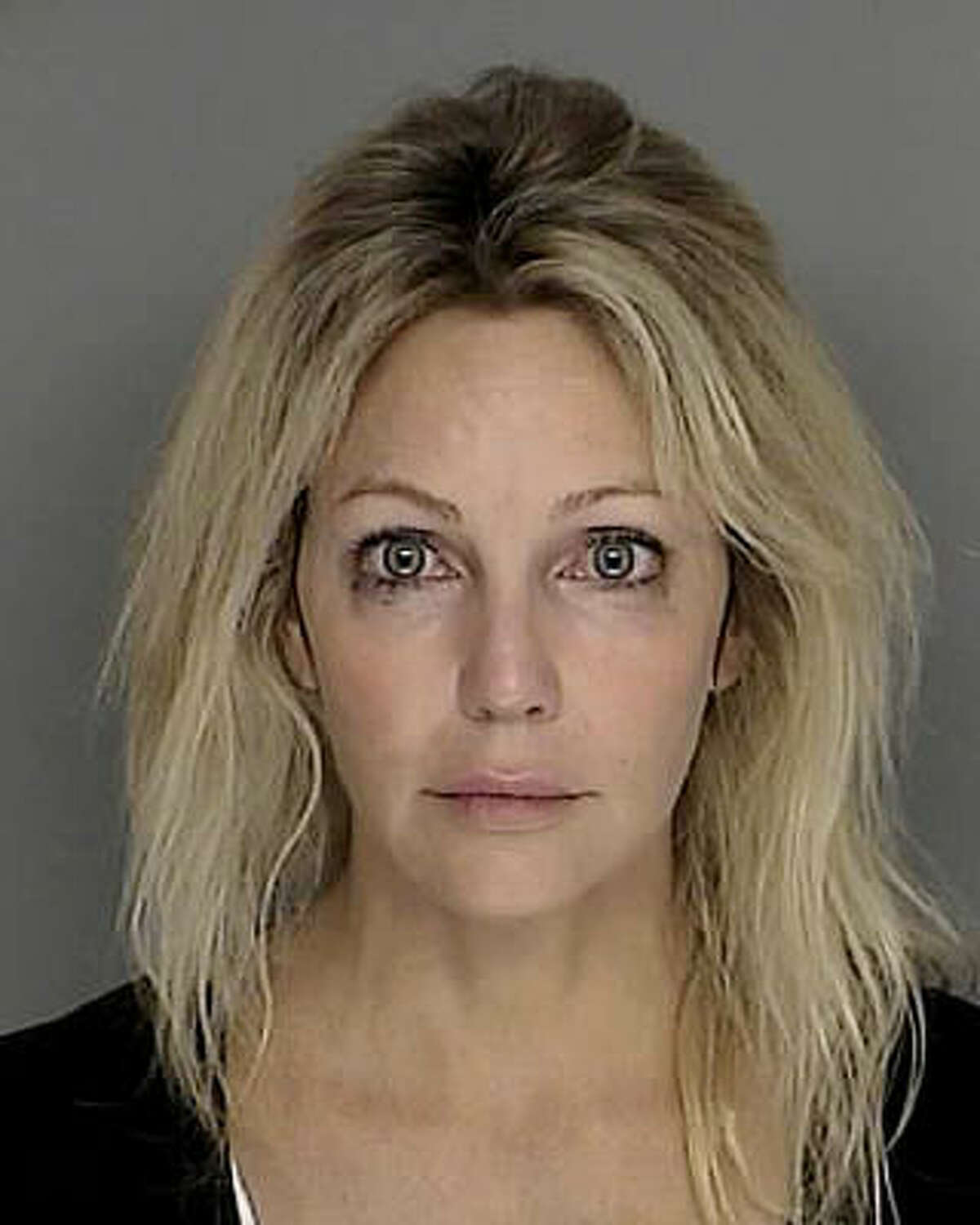 Heather Locklear Locklear was arrested after police say she was cited for hitting a no-parking sign on a public street and fleeing the scene. Locklear was still on probation after having had a previous run-in with the law back in 2008 on a DUI arrest.