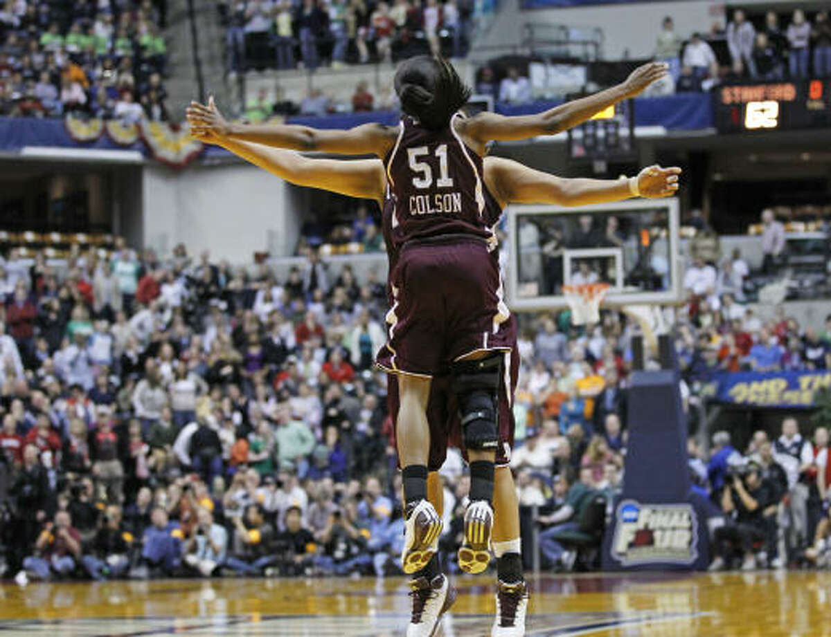 Texas A&M's Sydney Colson (51) celebrates with teammates after their 63-62 win over Stanford.