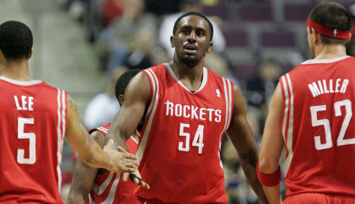 Rockets forward Patrick Patterson (54) is congratulated by teammates after his career-best game on Tuesday night.