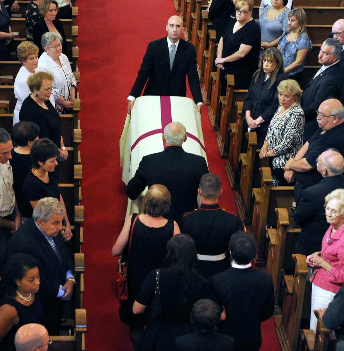The coffin bearing the body of former Danbury Mayor James E. Dyer is brought into St. Joseph Church in Danbury Monday morning, Aug. 1, 2011.
