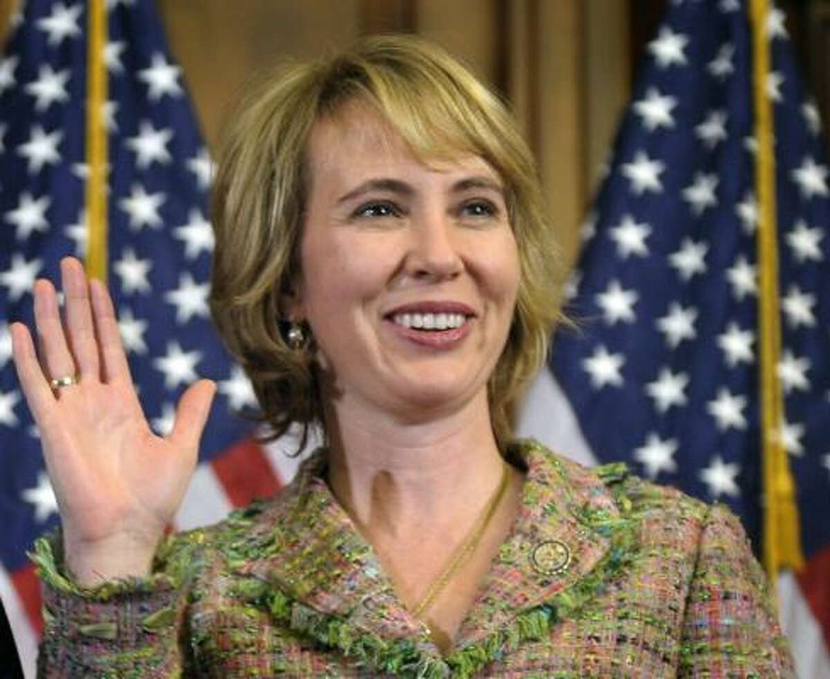A Jan. 5, 2011 file photo shows Rep. Gabrielle Giffords, D-Ariz., takes part in a re-enactment of her swearing-in, on Capitol Hill in Washington.