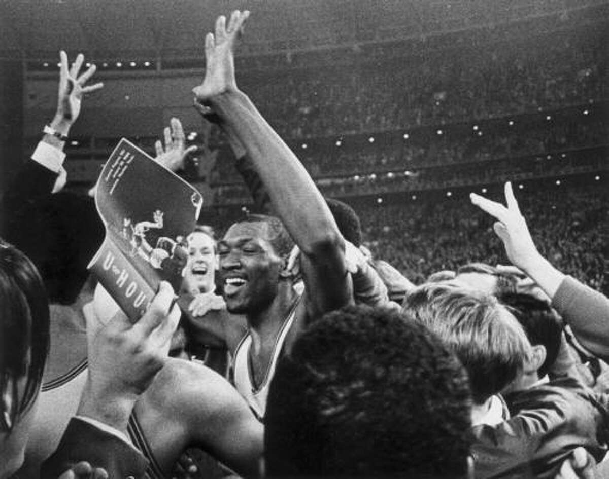 A mob of fans greets Elvin Hayes after his free throws sealed UH's win over UCLA at the Astrodome.