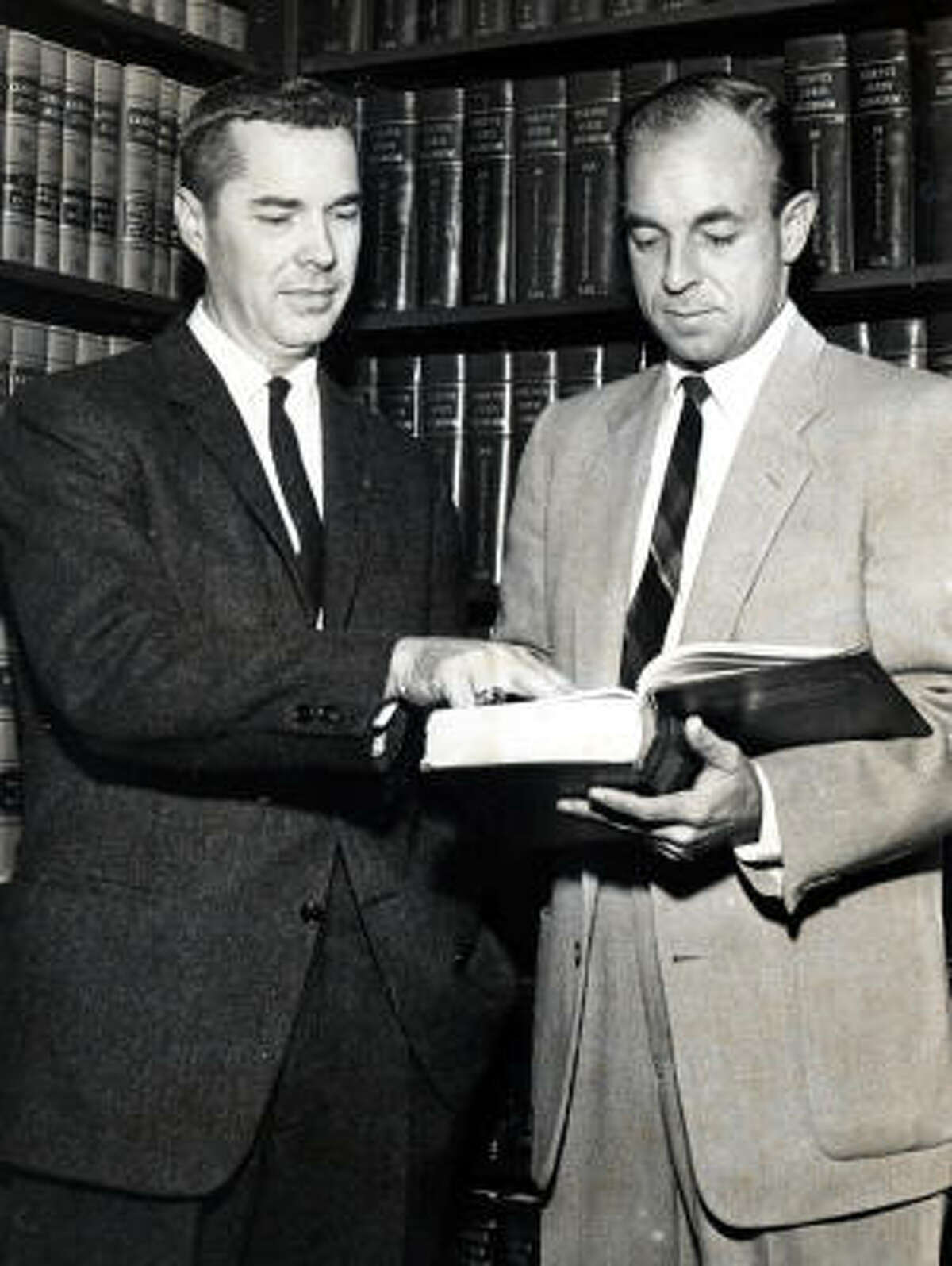 Then-Harris County District Attorney-elect Frank Briscoe, left, with aide Wallace C. "Pete" Moore in 1960.