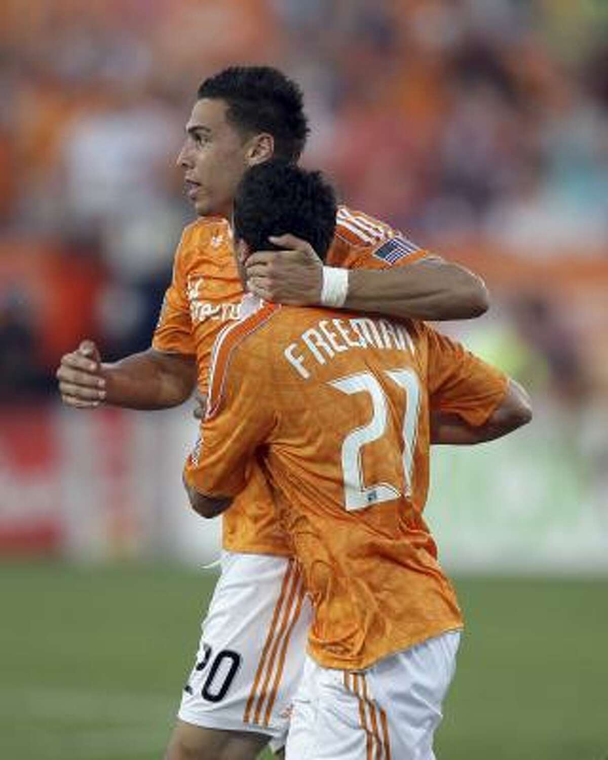 Dynamo players Geoff Cameron, left, and Hunter Freeman celebrate after a goal in the first half on Saturday.
