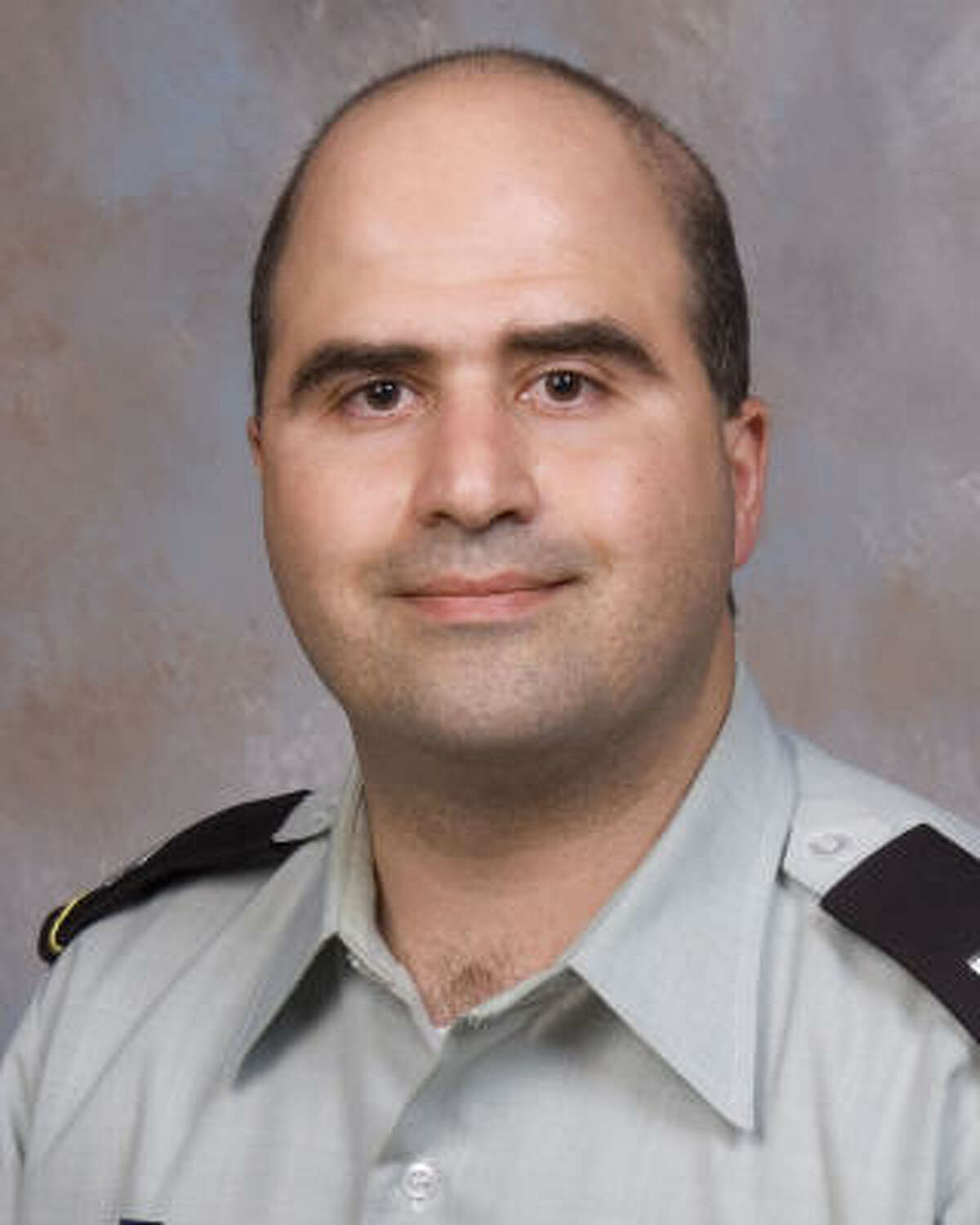 This 2007 file photo provided by the Uniformed Services University of the Health Sciences shows Nidal Malik Hasan when he entered the program for his Disaster and Military Psychiatry Fellowship.