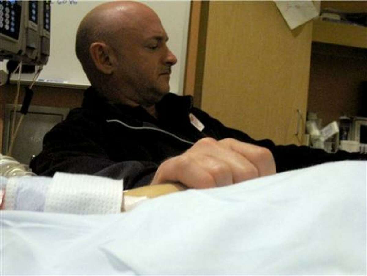 Mark Kelly visits his wife at an Arizona hospital.