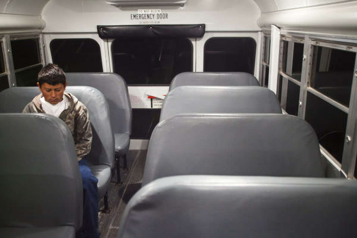 Charlie Steddun has the bus to himself during his hourlong ride to Wink Junior High School from his home in Loving County. For the district, fewer students means less funding.