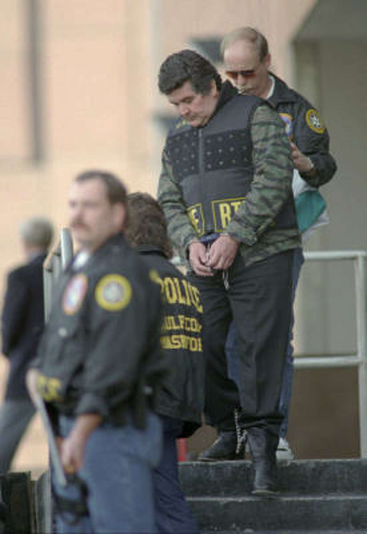 Juan Garcia Abrego, shown being escorted from the federal courthouse in 1996, was sentenced to 11 life terms, largely on the strength of testimony from a Mexican police commander who had been paid $1 million.