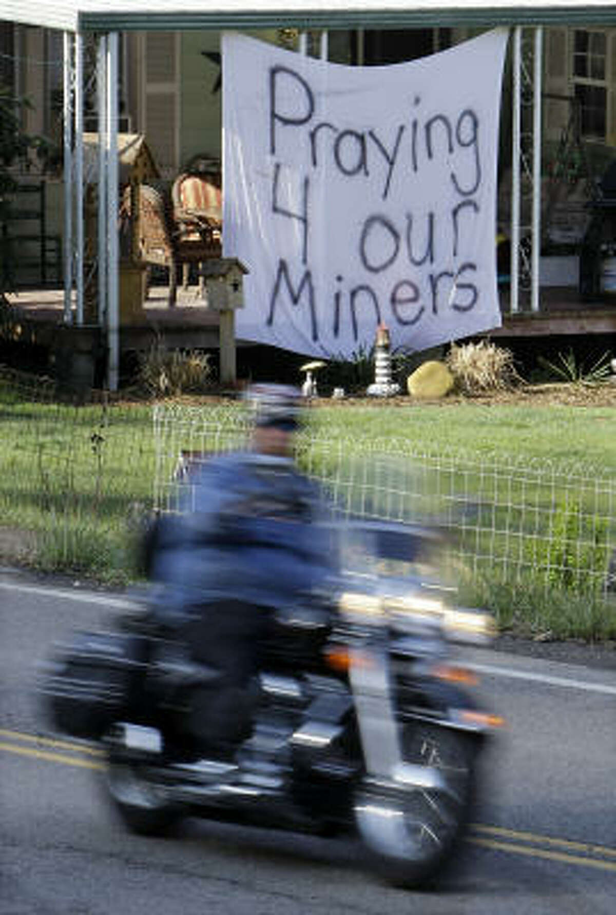 A sign expressing hope for coal miners hangs at a home in Montcoal, W.Va., on Tuesday.