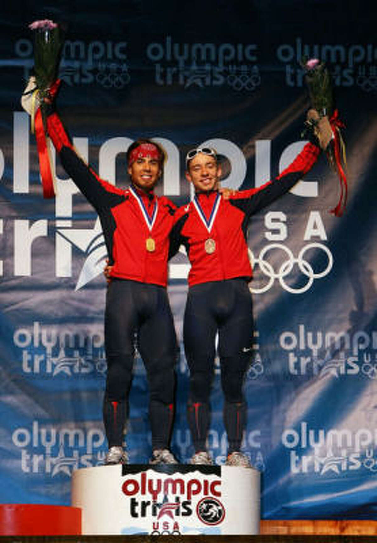 Jordan Malone, right, finished third place at the U.S. Short Track Speedskating Championships. In the Olympics, Apolo Anton Ohno, left, won a silver, but Malone finished with a DQ.