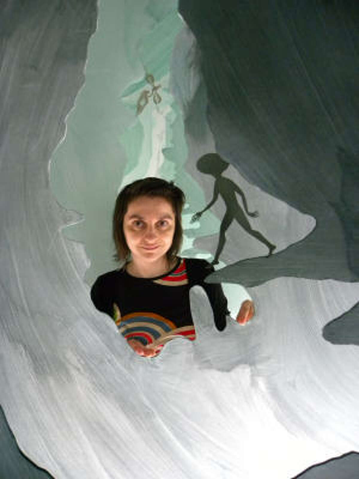 Artist Andrea Dezsö works on her installation Sometimes in My Dreams I Fly at Rice University Art Gallery.