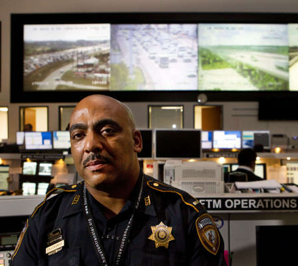 Harris County Sheriff's Deputy Lt. Darryl Coleman has a clear view of Houston-area traffic from his post inside TranStar's nerve center, which has more than 700 cameras in use.